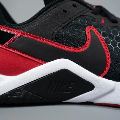 Nike Legend Essential 2 Black / Red - White  The Nike Legend Essential 2 comes equipped with a flat, stable heel, flexibility un