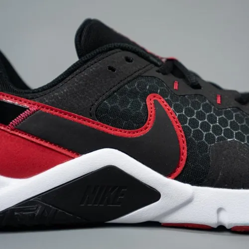 Nike Legend Essential 2 Black / Red - White  The Nike Legend Essential 2 comes equipped with a flat, stable heel, flexibility un